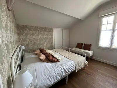 Un ou plusieurs lits dans un hébergement de l'établissement Maison WILSON