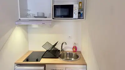 Cuisine ou kitchenette dans l'établissement Studio cosy - Quartier Prébendes, Tours centre