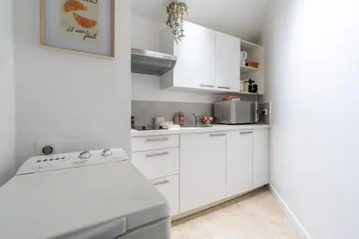 Cuisine ou kitchenette dans l'établissement Maison Camélia Grand T2 - 1 chambre