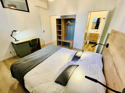 Un ou plusieurs lits dans un hébergement de l'établissement Appartement spacieux & familial, climatisation, hypercentre de Tours, le Belvédère