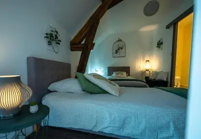 Un ou plusieurs lits dans un hébergement de l'établissement Chouette Nuit