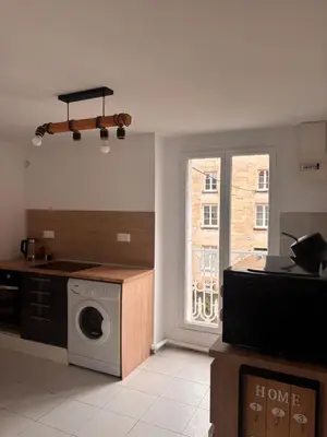 Cuisine ou kitchenette dans l'établissement Appartement calme en centre ville