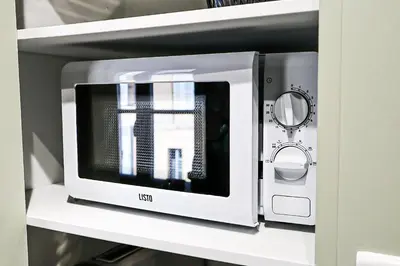 Cuisine ou kitchenette dans l'établissement Studio au pied du Vieux-Mans