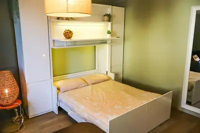 Un ou plusieurs lits dans un hébergement de l'établissement Studio au pied du Vieux-Mans