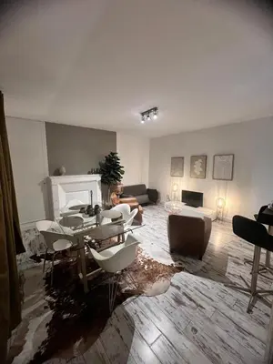 Coin salon dans l'établissement Appartement au pied du Vieux-Mans