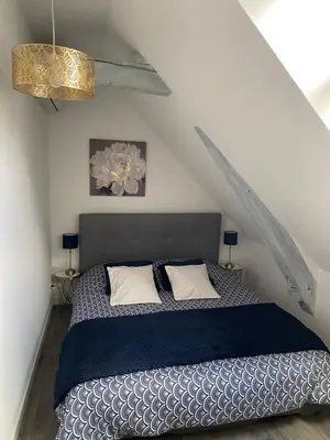 Un ou plusieurs lits dans un hébergement de l'établissement La bergerie des petites maisons avec spa