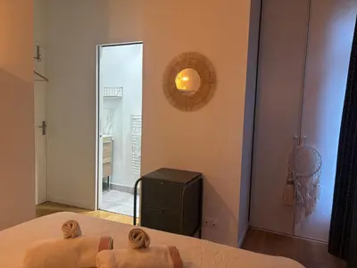 Un ou plusieurs lits dans un hébergement de l'établissement L'Appartement Buffon - Coeur de Tours
