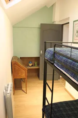 Un ou plusieurs lits dans un hébergement de l'établissement Charmante maison à la campagne