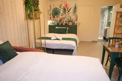 Un ou plusieurs lits dans un hébergement de l'établissement Le Studio Vert