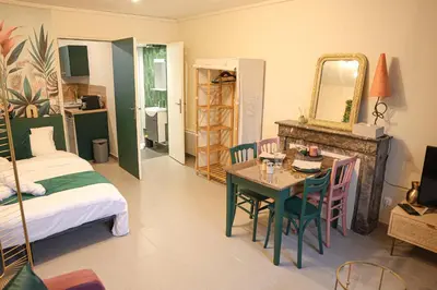 Un ou plusieurs lits dans un hébergement de l'établissement Le Studio Vert