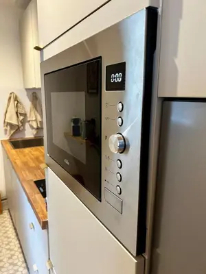 Cuisine ou kitchenette dans l'établissement Cosy 24 - Le Mans City Center