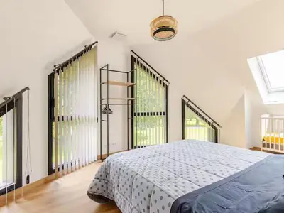 Un ou plusieurs lits dans un hébergement de l'établissement Maison d'architecte avec piscine chauffée et parc sécurisé - FR-1-410-487