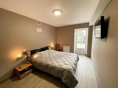 Un ou plusieurs lits dans un hébergement de l'établissement Gîte confortable avec WIFI, parking, climatisation en Touraine - FR-1-381-644