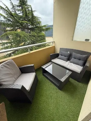 Coin salon dans l'établissement Appartement 24h - Le Mans