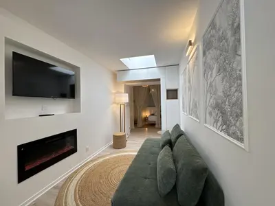 Télévision ou salle de divertissement dans l'établissement La Petite Mancelle - Hôpital du Mans