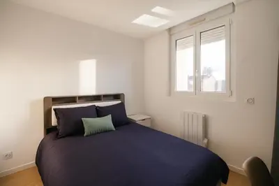Un ou plusieurs lits dans un hébergement de l'établissement House with 9 Private Suites near Le Mans Circuit