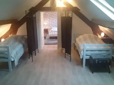 Un ou plusieurs lits dans un hébergement de l'établissement Holiday Home Maison le Pressoir in Vallières-les-Grandes by Interhome