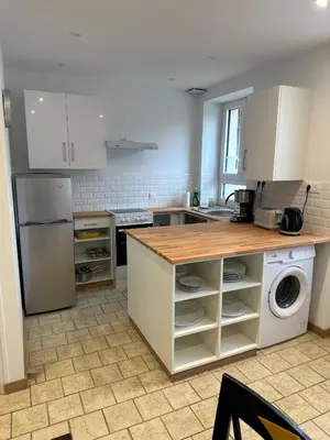 Cuisine ou kitchenette dans l'établissement Le Cottage