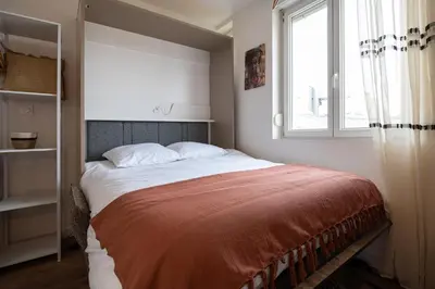Un ou plusieurs lits dans un hébergement de l'établissement 305 Chanzy - Ethnique Chic - Studio Premium - Wifi