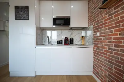 Cuisine ou kitchenette dans l'établissement 307 Chanzy - Industriel - Studio Design - Centre