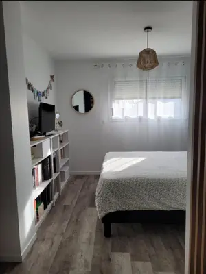 Un ou plusieurs lits dans un hébergement de l'établissement Chambre à 20min du Circuit