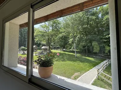 Jardin de l'établissement Gite au coeur des bois - Le Chêne du Verger