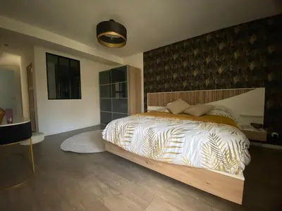 Un ou plusieurs lits dans un hébergement de l'établissement Maison d'architecte