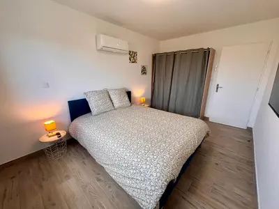 Un ou plusieurs lits dans un hébergement de l'établissement Maison Rosie - Maison moderne cozy avec extérieur