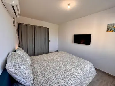 Un ou plusieurs lits dans un hébergement de l'établissement Maison Rosie - Maison moderne cozy avec extérieur