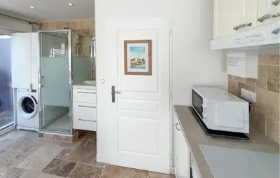 Cuisine ou kitchenette dans l'établissement Studio Tout Confort