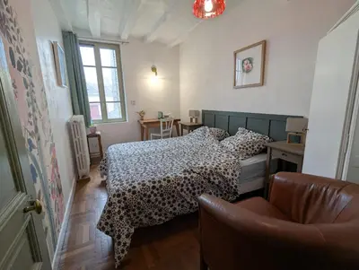 Un ou plusieurs lits dans un hébergement de l'établissement Le Tintamarre - Chambres et suite familiale à 5 min du Zoo de Beauval
