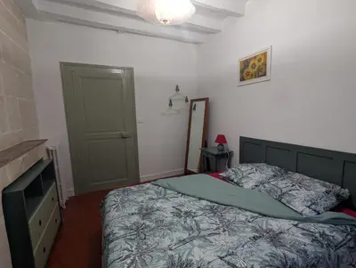Un ou plusieurs lits dans un hébergement de l'établissement Le Tintamarre - Chambres et suite familiale à 5 min du Zoo de Beauval