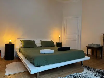 Un ou plusieurs lits dans un hébergement de l'établissement Maison de charme centrale & jardin - 24h du Mans