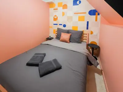Un ou plusieurs lits dans un hébergement de l'établissement Le Lodge Corail - Massage Réparateur & Design Fun