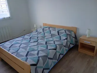 Un ou plusieurs lits dans un hébergement de l'établissement Maison Marigné Laillé
