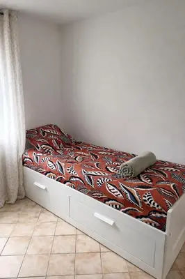 Un ou plusieurs lits dans un hébergement de l'établissement Les 2 Tilleuls - Maison de charme avec jardin