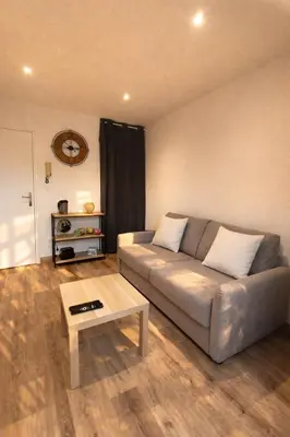Coin salon dans l'établissement Escapade urbaine cosy – Rue Nationale