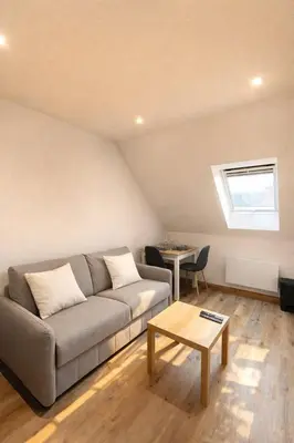 Coin salon dans l'établissement Escapade urbaine cosy – Rue Nationale
