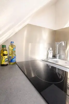 Cuisine ou kitchenette dans l'établissement Escapade urbaine cosy – Rue Nationale