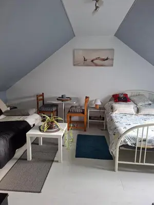Un ou plusieurs lits dans un hébergement de l'établissement Chambre à l étage chez un particulier