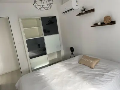 Un ou plusieurs lits dans un hébergement de l'établissement Appartement terrasse en ville