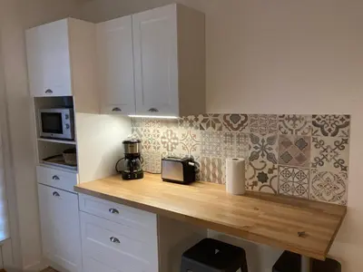 Cuisine ou kitchenette dans l'établissement Chambre à louer 24h Le Mans