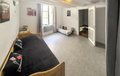 Un ou plusieurs lits dans un hébergement de l'établissement Charmante Maison De Ville