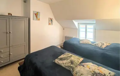 Un ou plusieurs lits dans un hébergement de l'établissement Charmante Maison De Ville