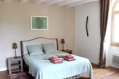Un ou plusieurs lits dans un hébergement de l'établissement Chambres d'hôtes La Buronnière