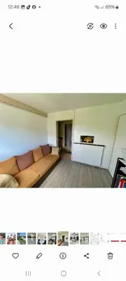 Coin salon dans l'établissement Maison proche circuit 24h00 Le Mans