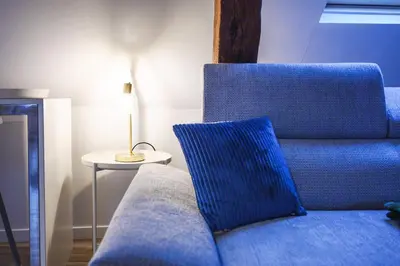 Coin salon dans l'établissement Magnifique loft au pied du tram - Wifi - Bureau