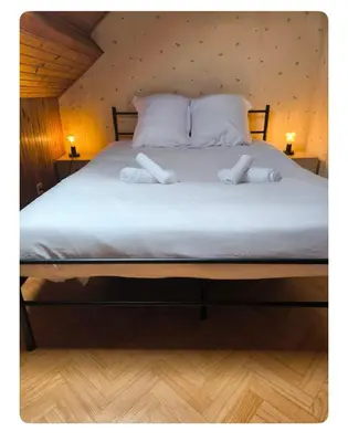 Un ou plusieurs lits dans un hébergement de l'établissement Maison Atypique 5 chambres