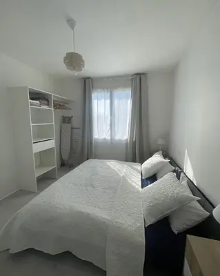Un ou plusieurs lits dans un hébergement de l'établissement Maison spacieuse & lumineuse à Châtellerault