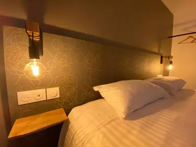 Un ou plusieurs lits dans un hébergement de l'établissement Le bois Dormant By Saumur Signature